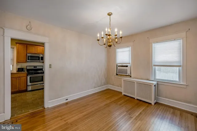 a kitchen with stainless steel appliances granite countertop a refrigerator a stove top oven a sink dishwasher and wooden cabinets