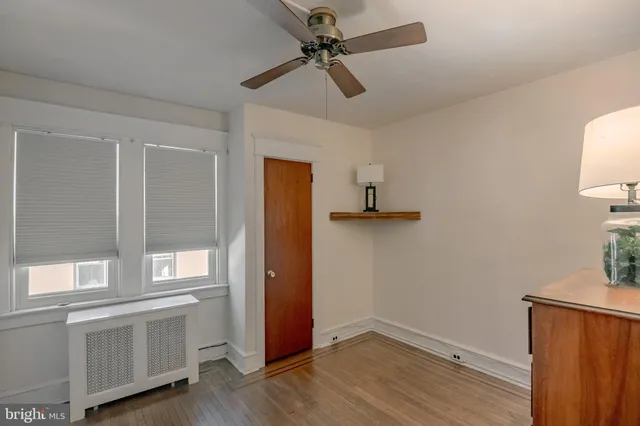 a bathroom with a sink vanity mirror and toilet