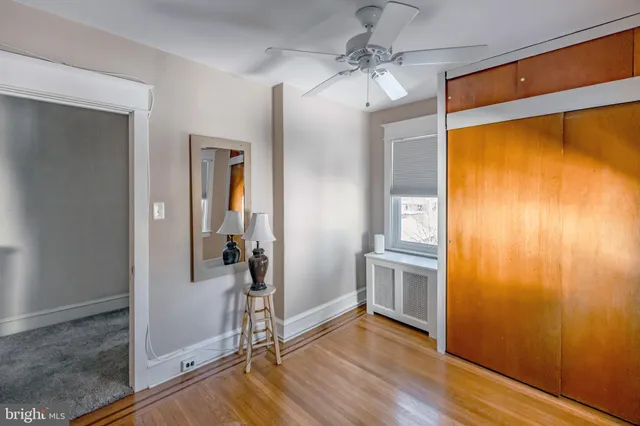 a living room with furniture and a chair