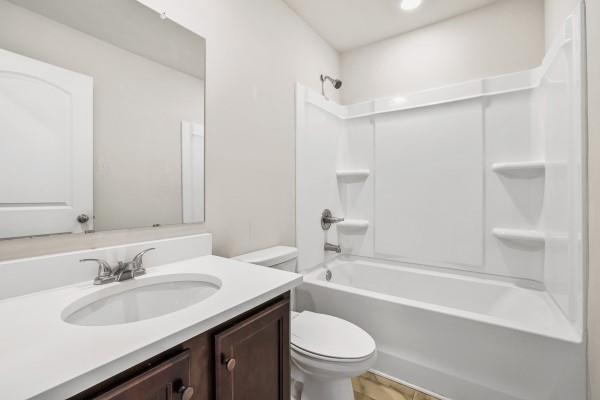 292 Whitetail Circle Canton, GA 30115 - Photo 11 of 17 a bathroom with a sink toilet vanity and bathtub