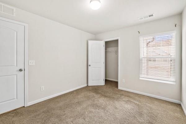 292 Whitetail Circle Canton, GA 30115 - Photo 12 of 17 a view of an empty room with a window