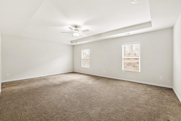 292 Whitetail Circle Canton, GA 30115 - Photo 15 of 17 an empty room with a window and ceiling fan