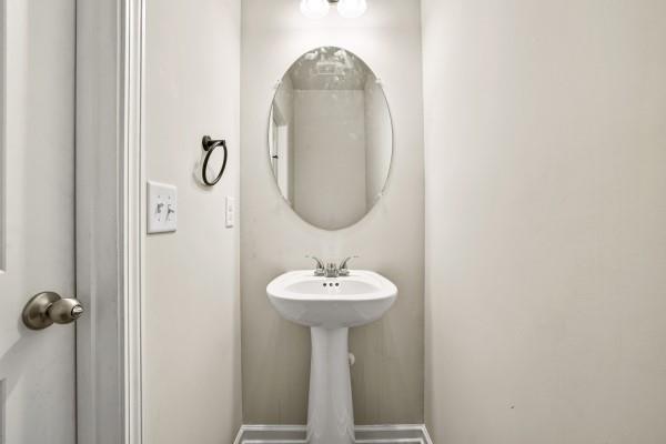 292 Whitetail Circle Canton, GA 30115 - Photo 8 of 17 a bathroom with a sink a mirror and shower