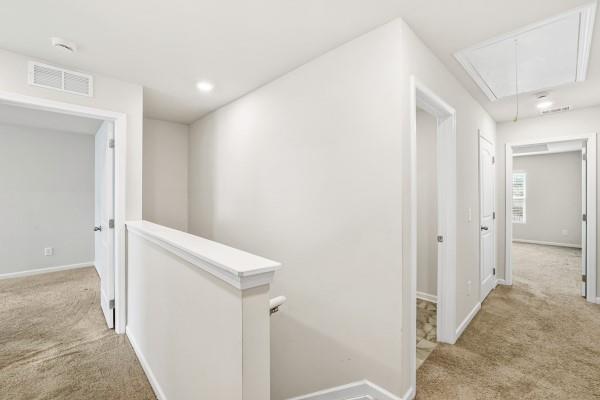 292 Whitetail Circle Canton, GA 30115 - Photo 9 of 17 a view of a hallway with closet and bathroom