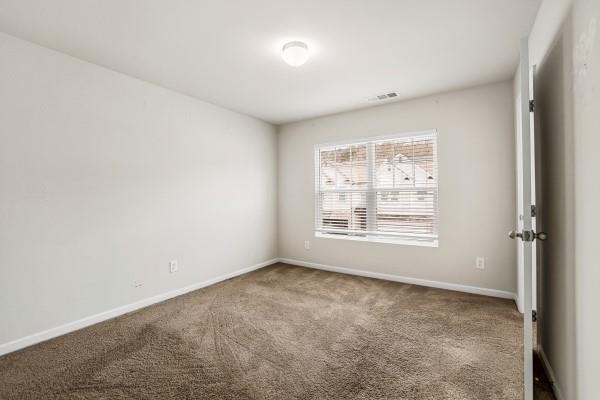 292 Whitetail Circle Canton, GA 30115 - Photo 10 of 17 an empty room with a window
