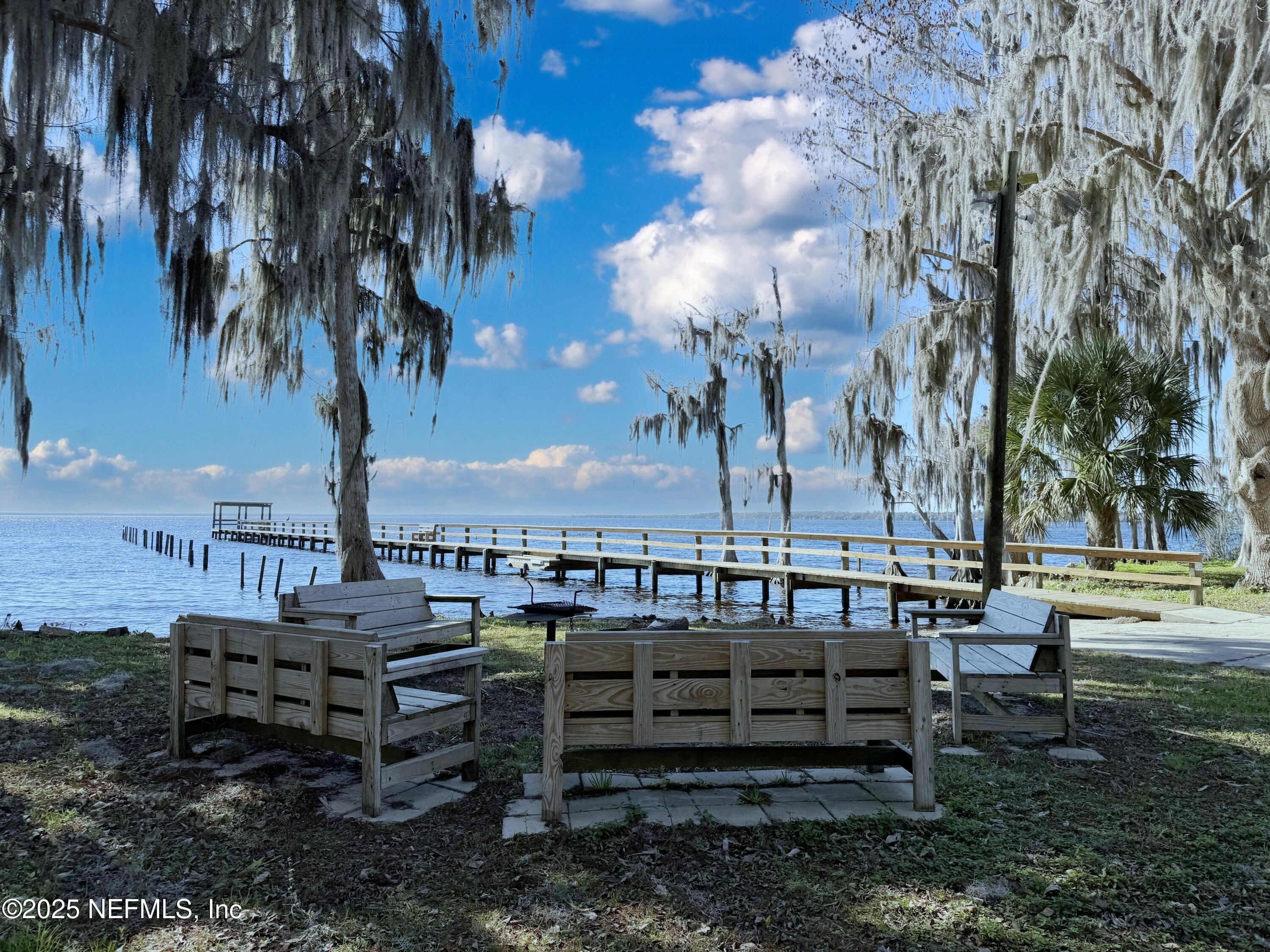 136 Helen Avenue Georgetown, FL 32139 - Photo 20 of 25 a view of a chairs and tables in the backyard