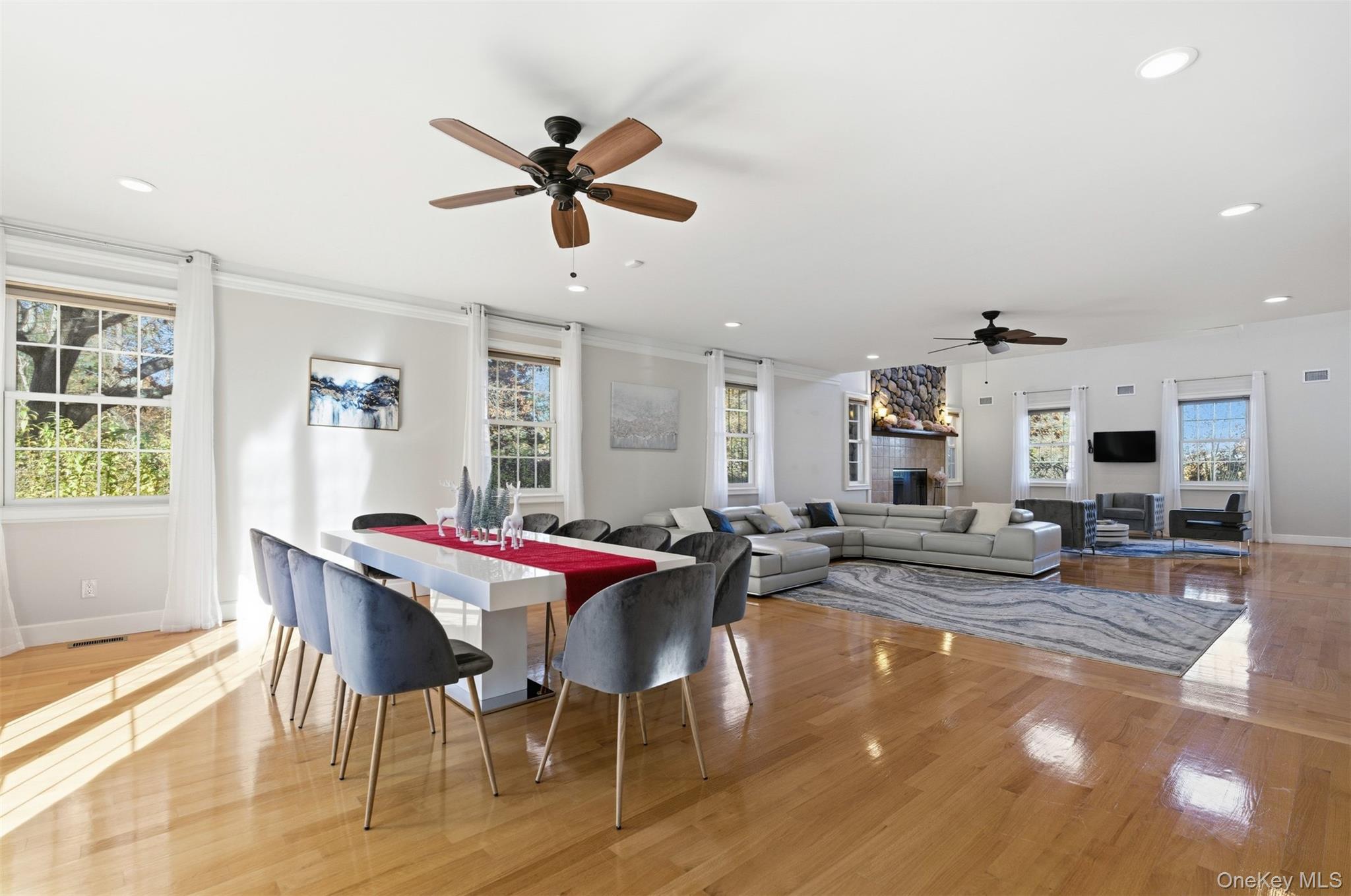 33 A Newtown Road Hampton Bays, NY 11946 - Photo 26 of 50 Dining space featuring ceiling fan, light wood-type flooring, recessed lighting, and crown molding