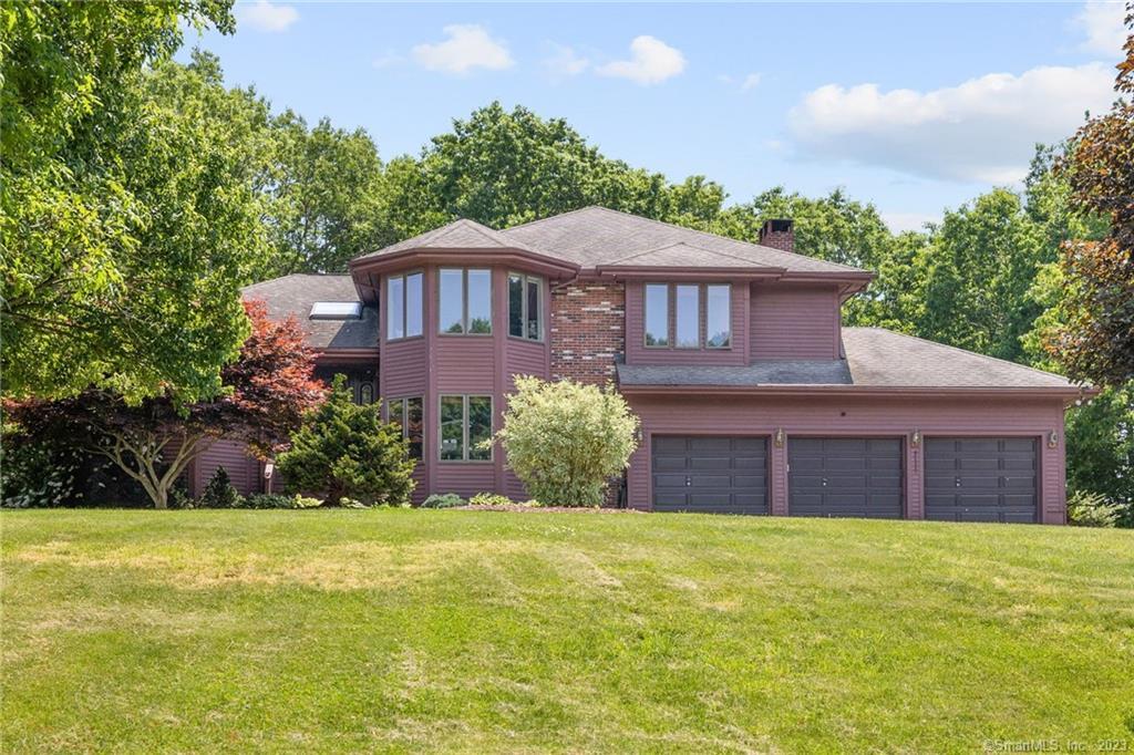 67 Idlewood Road Wolcott, CT 06716 - Photo 1 of 1 a front view of a house with a yard