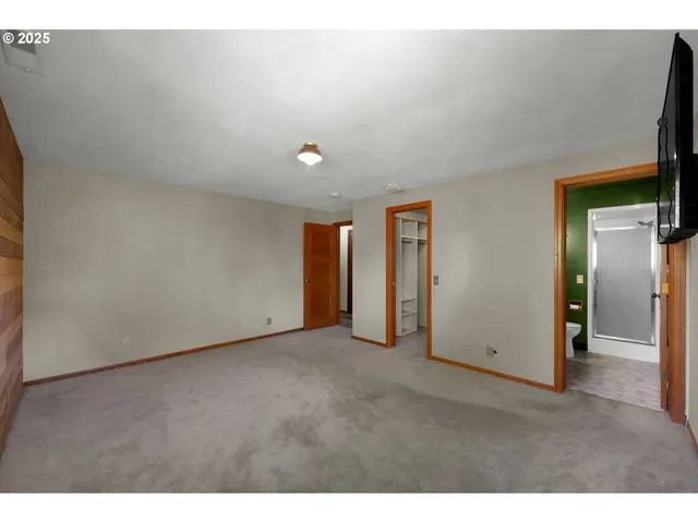 a view of an empty room and a window