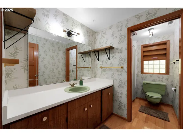 a bathroom with a sink double vanity and a mirror
