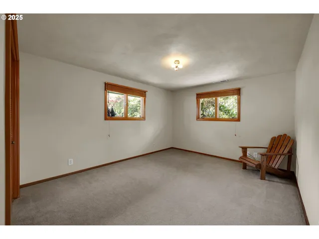 a view of a room with gym equipment and a window