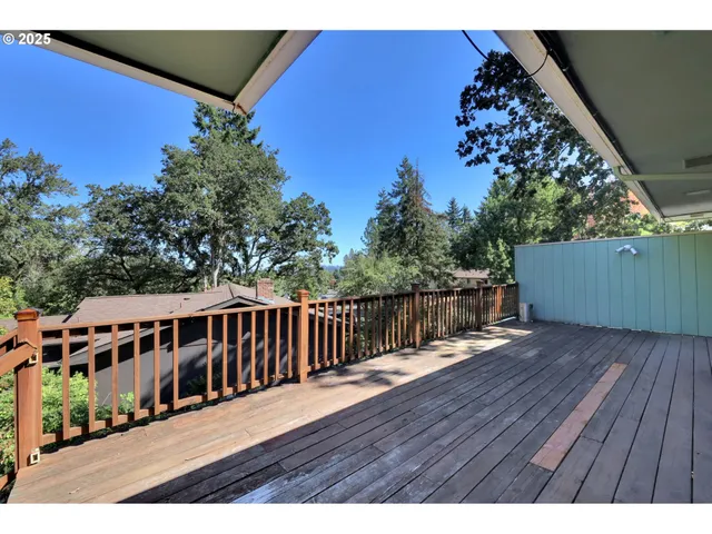 a view of balcony with wooden floor
