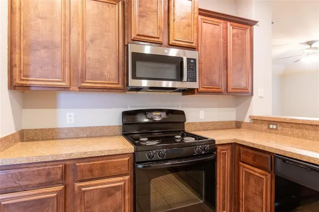 a kitchen with a stove and a microwave