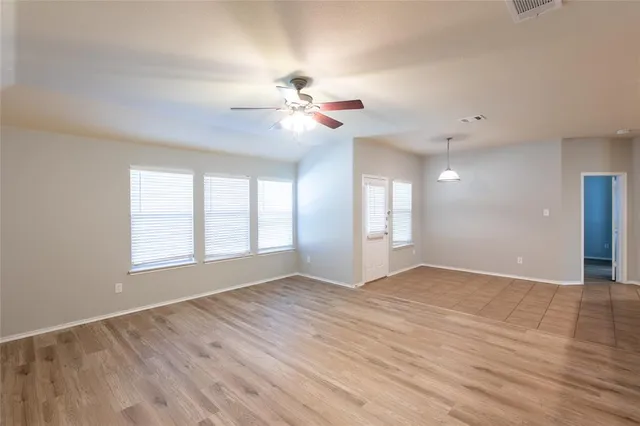 a view of an empty room with a window