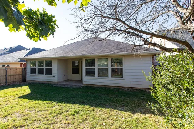 a view of a swimming pool with a yard