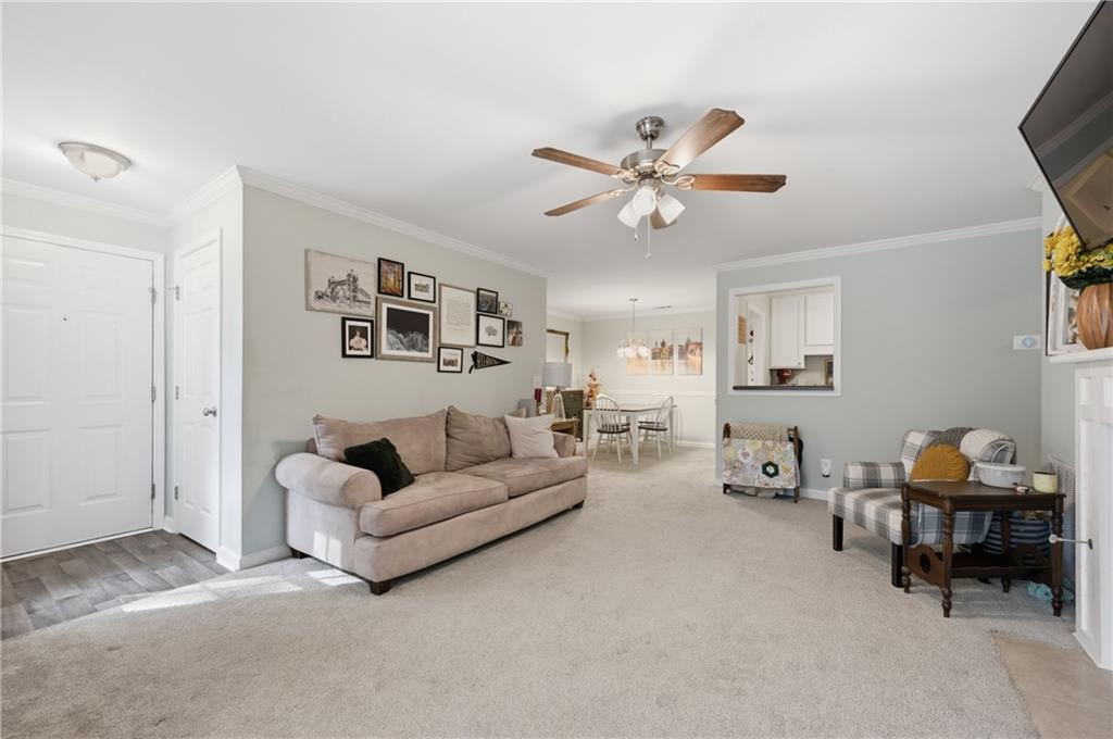 1007 Olde Mill Lane Norcross, GA 30093 - Photo 7 of 32 a living room with furniture and a ceiling fan