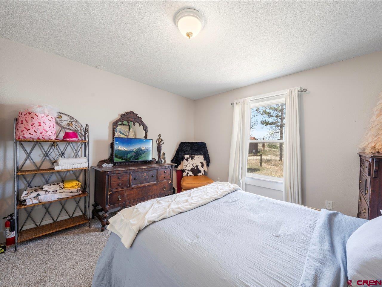 22244 F Road Delta, CO 81416 - Photo 22 of 41 a bedroom with a bed and a window