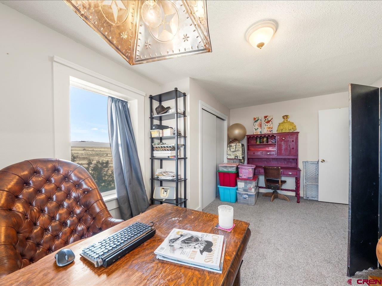 22244 F Road Delta, CO 81416 - Photo 25 of 41 a bedroom with a bed and a window