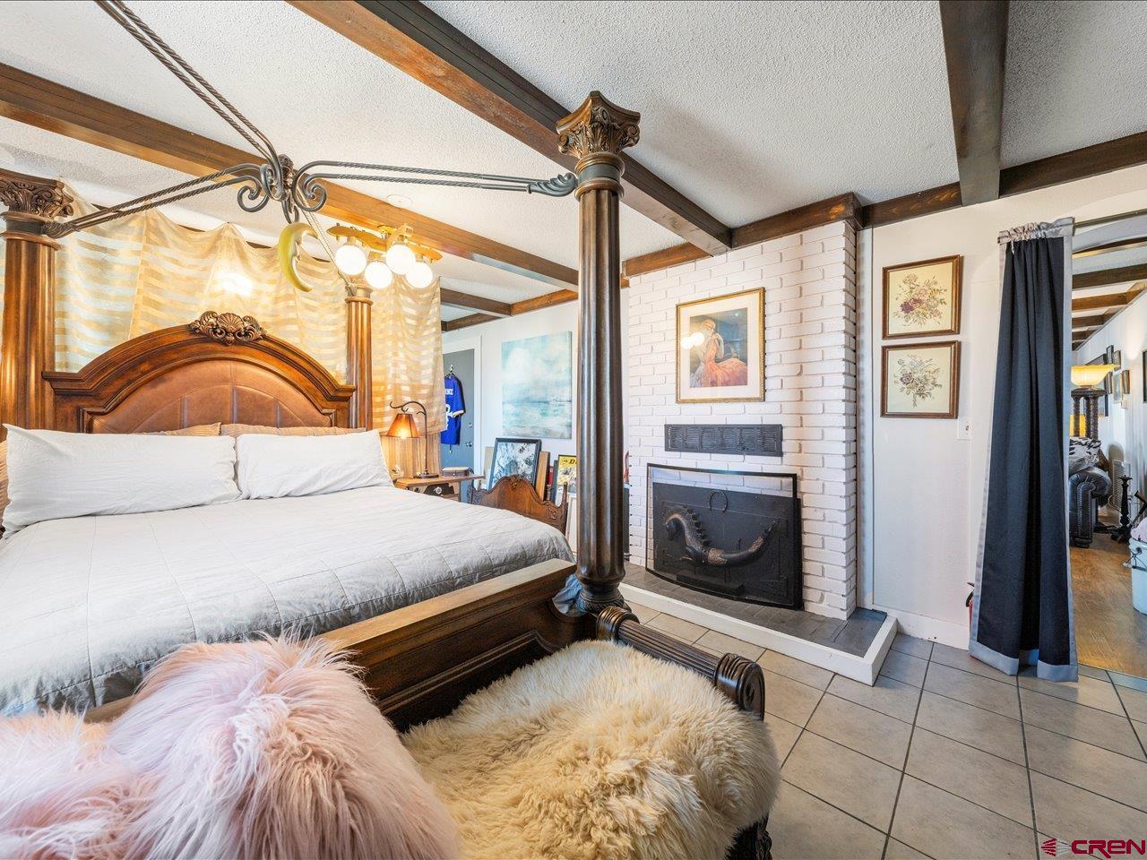 22244 F Road Delta, CO 81416 - Photo 27 of 41 a bedroom with a bed and a mirror