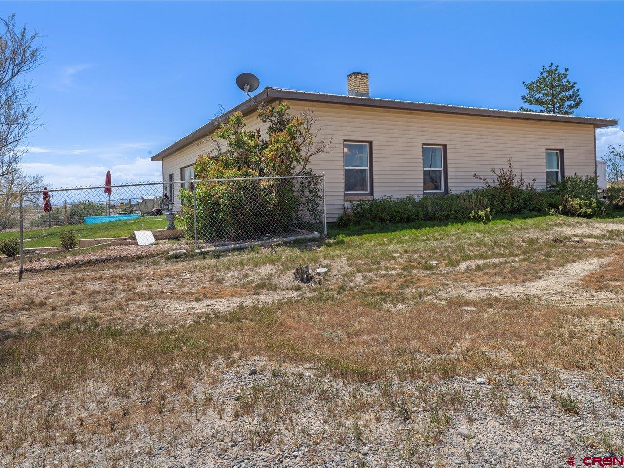 22244 F Road Delta, CO 81416 - Photo 29 of 41 a view of a house with a yard