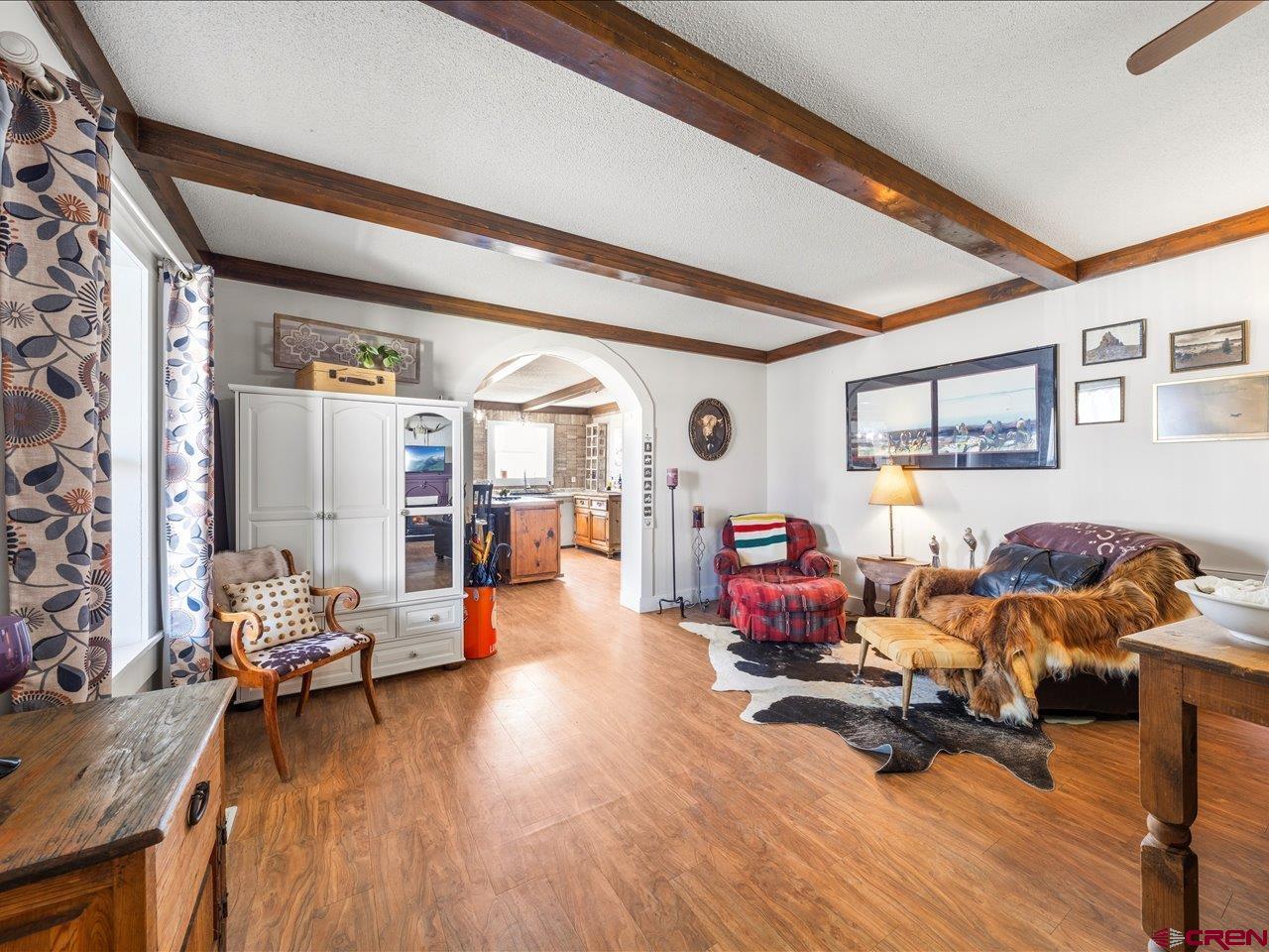 22244 F Road Delta, CO 81416 - Photo 6 of 41 a living room with furniture and a wooden floor