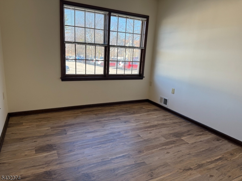 551 Valley Road, Unit 2 Montclair, NJ 07043 - Photo 7 of 9 wooden floor and window in an empty room