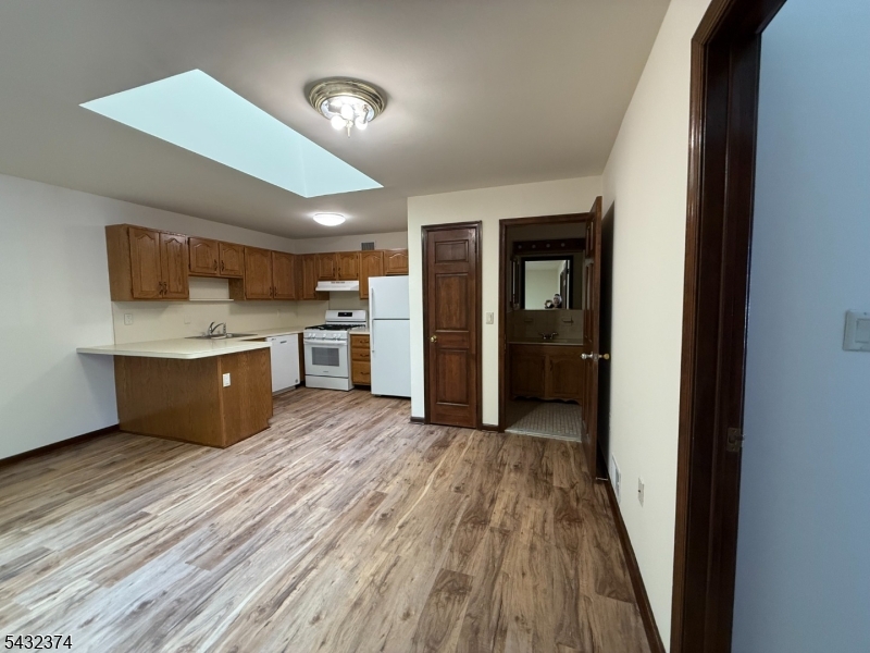 551 Valley Road, Unit 2 Montclair, NJ 07043 - Photo 8 of 9 a view of kitchen with wooden floor