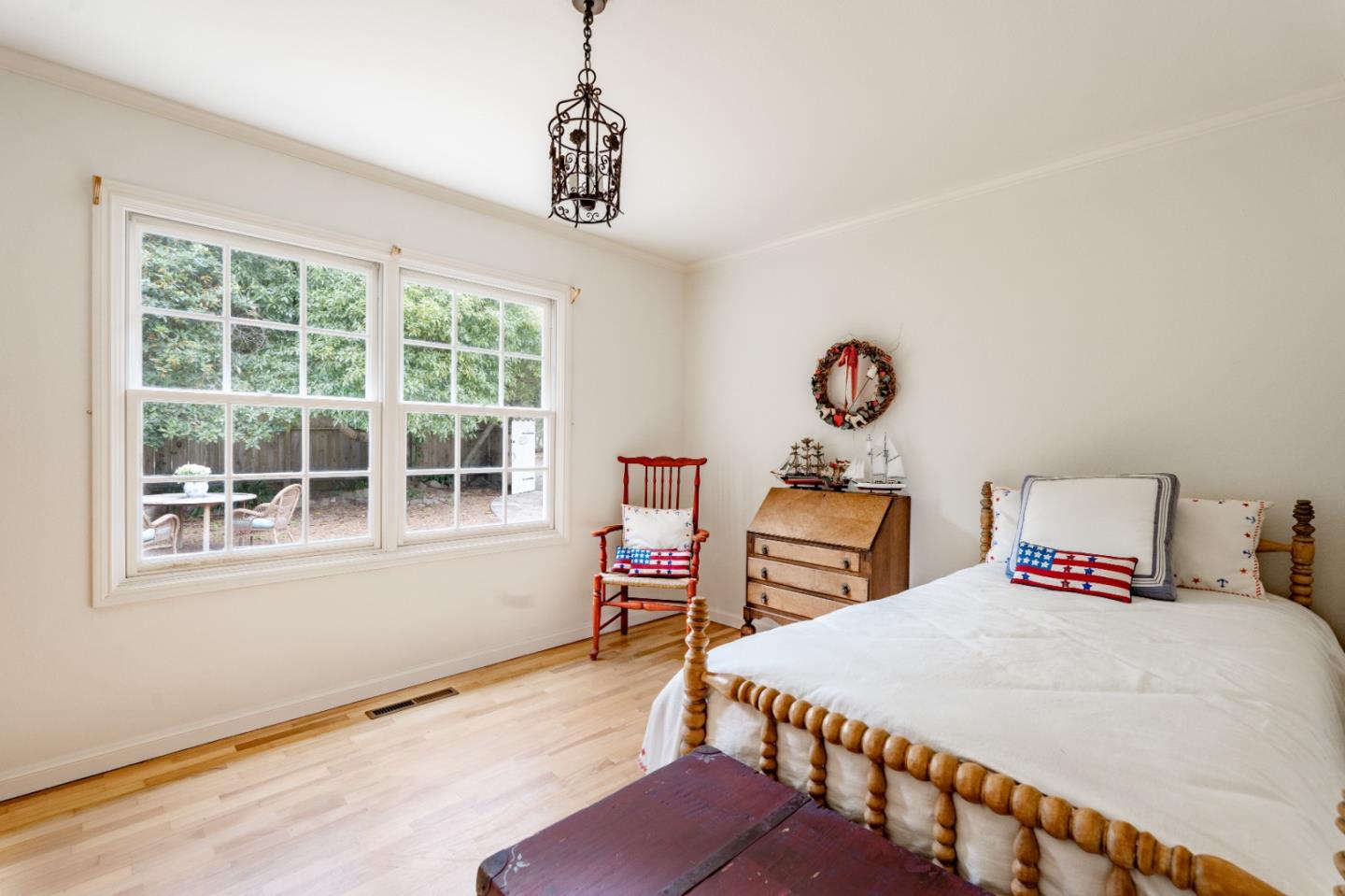 2952 Stevenson Drive Pebble Beach, CA 93953 - Photo 14 of 23 a bedroom with bed and wooden floor