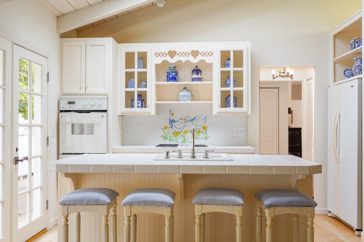 2952 Stevenson Drive Pebble Beach, CA 93953 - Photo 6 of 23 a dining table with chairs and wooden floor