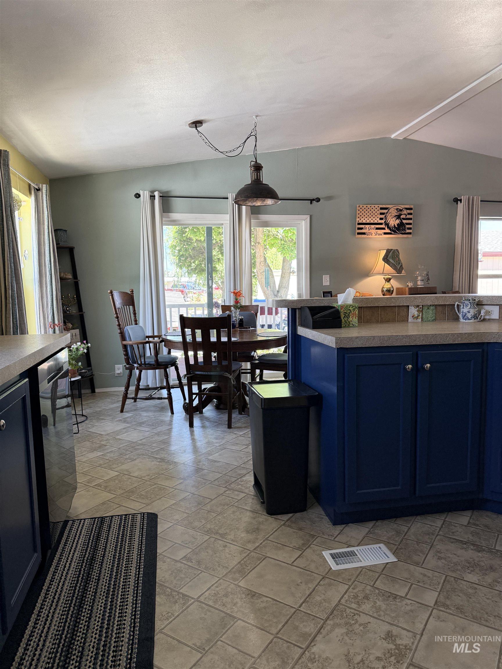 2750 Alden Road, Unit 12 12 Fruitland, ID 83619 - Photo 15 of 38 Interior room featuring vaulted ceilings, flush mount lighting, and light-colored carpeting