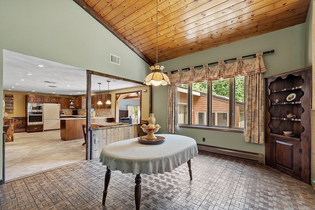14 Shawmut Avenue Danvers, MA 01923 - Photo 11 of 40 a living room with furniture and a table