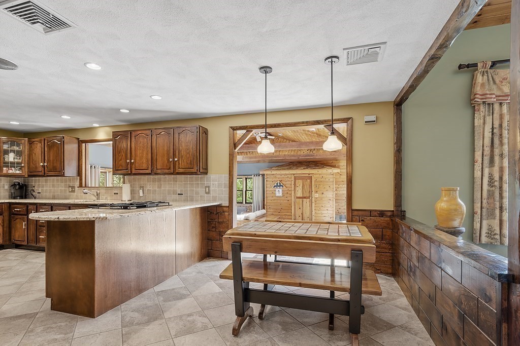 14 Shawmut Avenue Danvers, MA 01923 - Photo 13 of 40 a kitchen with a refrigerator a sink and cabinets