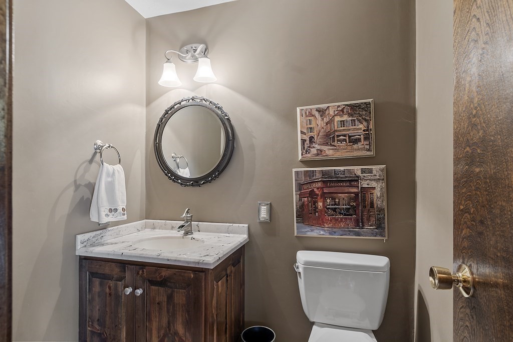 14 Shawmut Avenue Danvers, MA 01923 - Photo 17 of 40 a bathroom with a toilet a sink and a mirror