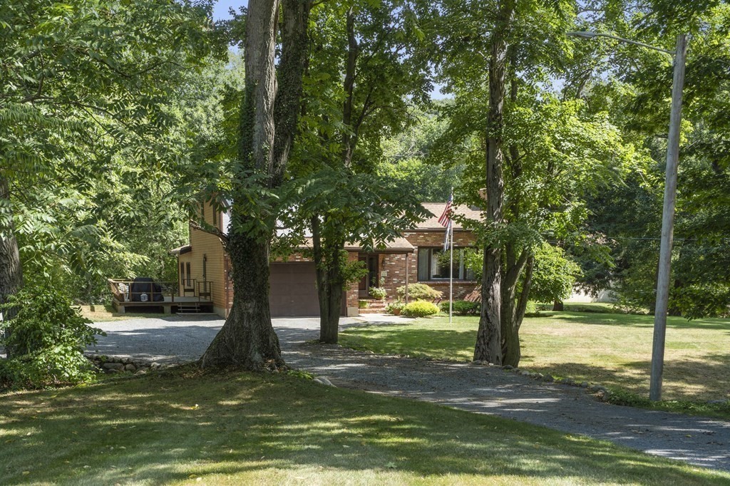 14 Shawmut Avenue Danvers, MA 01923 - Photo 2 of 40 a view of a yard with a tree
