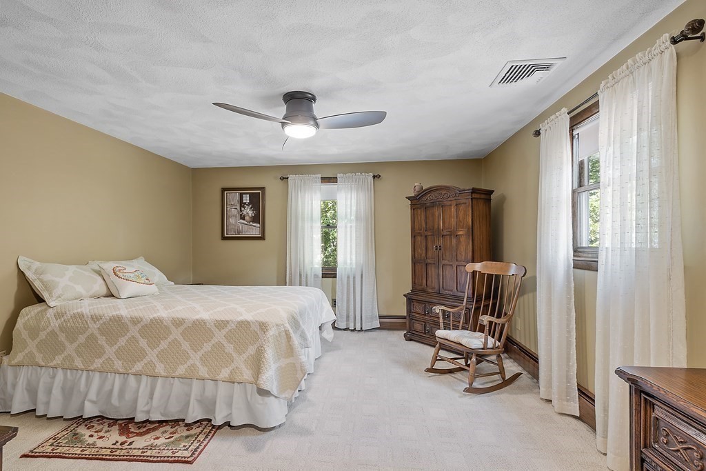 14 Shawmut Avenue Danvers, MA 01923 - Photo 23 of 40 a bedroom with a bed a chair and a large window