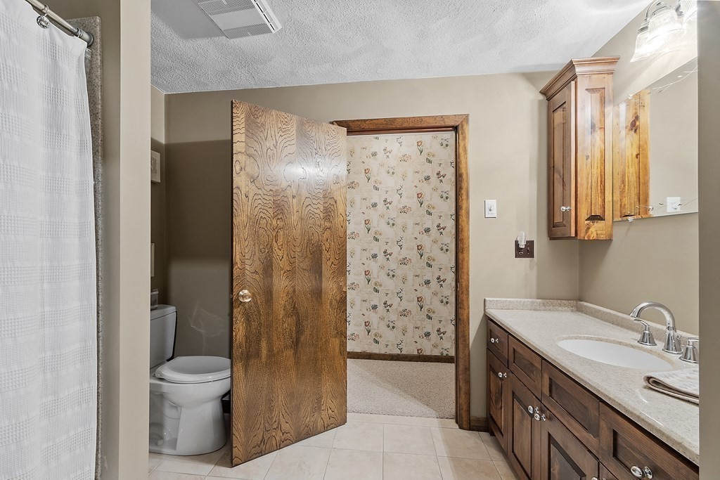 14 Shawmut Avenue Danvers, MA 01923 - Photo 26 of 40 a bathroom with a granite countertop sink toilet and shower