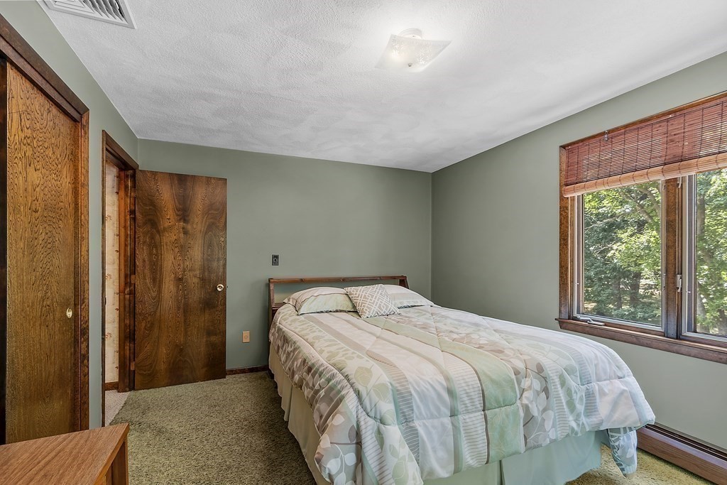 14 Shawmut Avenue Danvers, MA 01923 - Photo 27 of 40 a bedroom with a bed and a large window