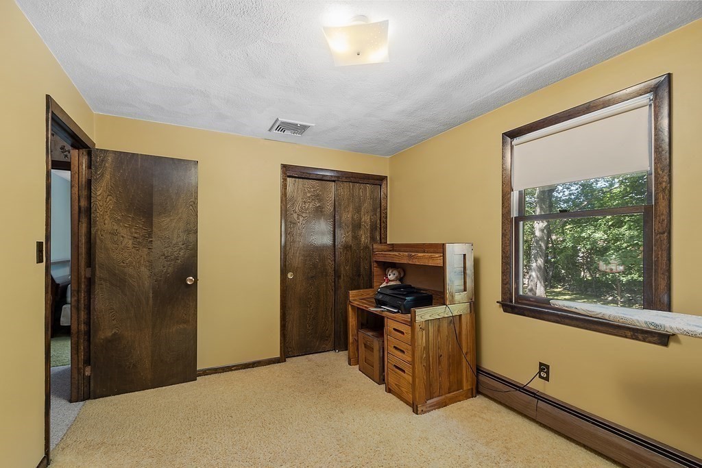 14 Shawmut Avenue Danvers, MA 01923 - Photo 29 of 40 a view of room with flat screen tv and refrigerator