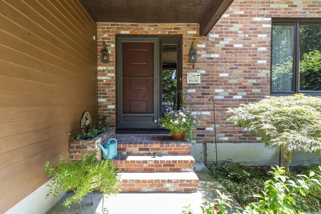 14 Shawmut Avenue Danvers, MA 01923 - Photo 39 of 40 a view of brick house with potted plants