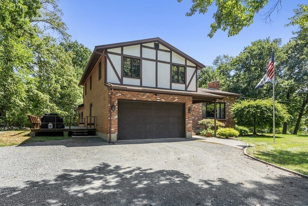 14 Shawmut Avenue Danvers, MA 01923 - Photo 40 of 40 a front view of a house with a yard and garage