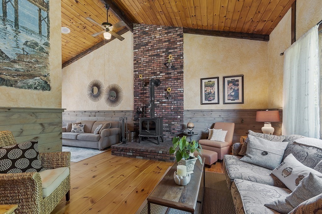 14 Shawmut Avenue Danvers, MA 01923 - Photo 8 of 40 a living room with furniture and a painting on the wall