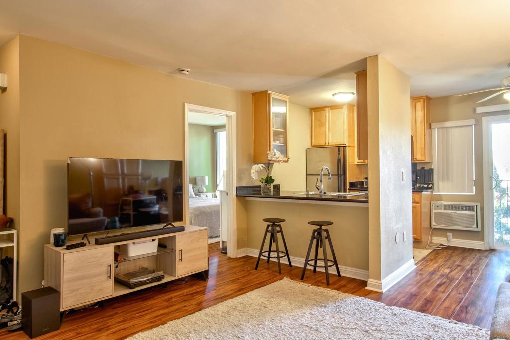 4860 Rolando Court, Unit 81 San Diego, CA 92115 - Photo 1 of 18 a living room with a flat screen tv and outdoor view