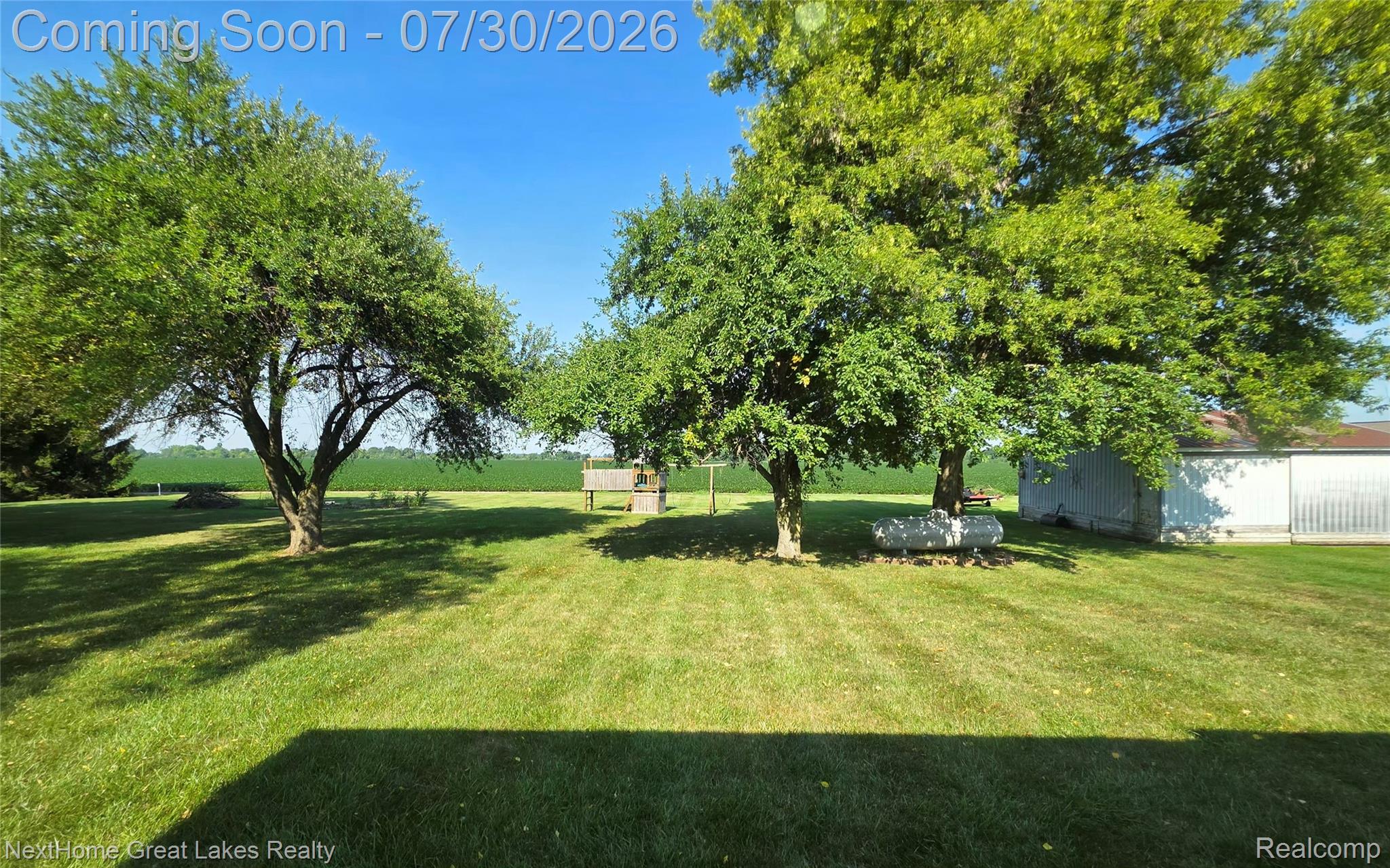 6249 North New Lothrop Road New Lothrop, MI 48460 - Photo 4 of 50 Expansive lawn area featuring multiple mature trees