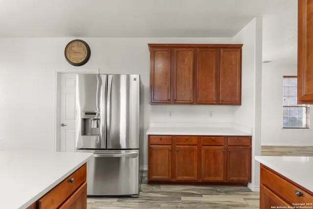 a kitchen with a refrigerator and a sink
