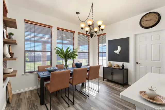 a view of a livingroom with furniture window and wooden floor