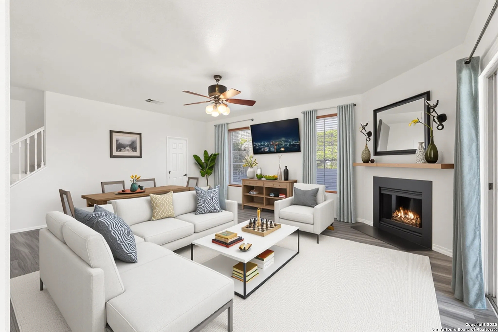 11101 Baywave Live Oak, TX 78233 - Photo 21 of 38 a living room with furniture a fireplace and a flat screen tv
