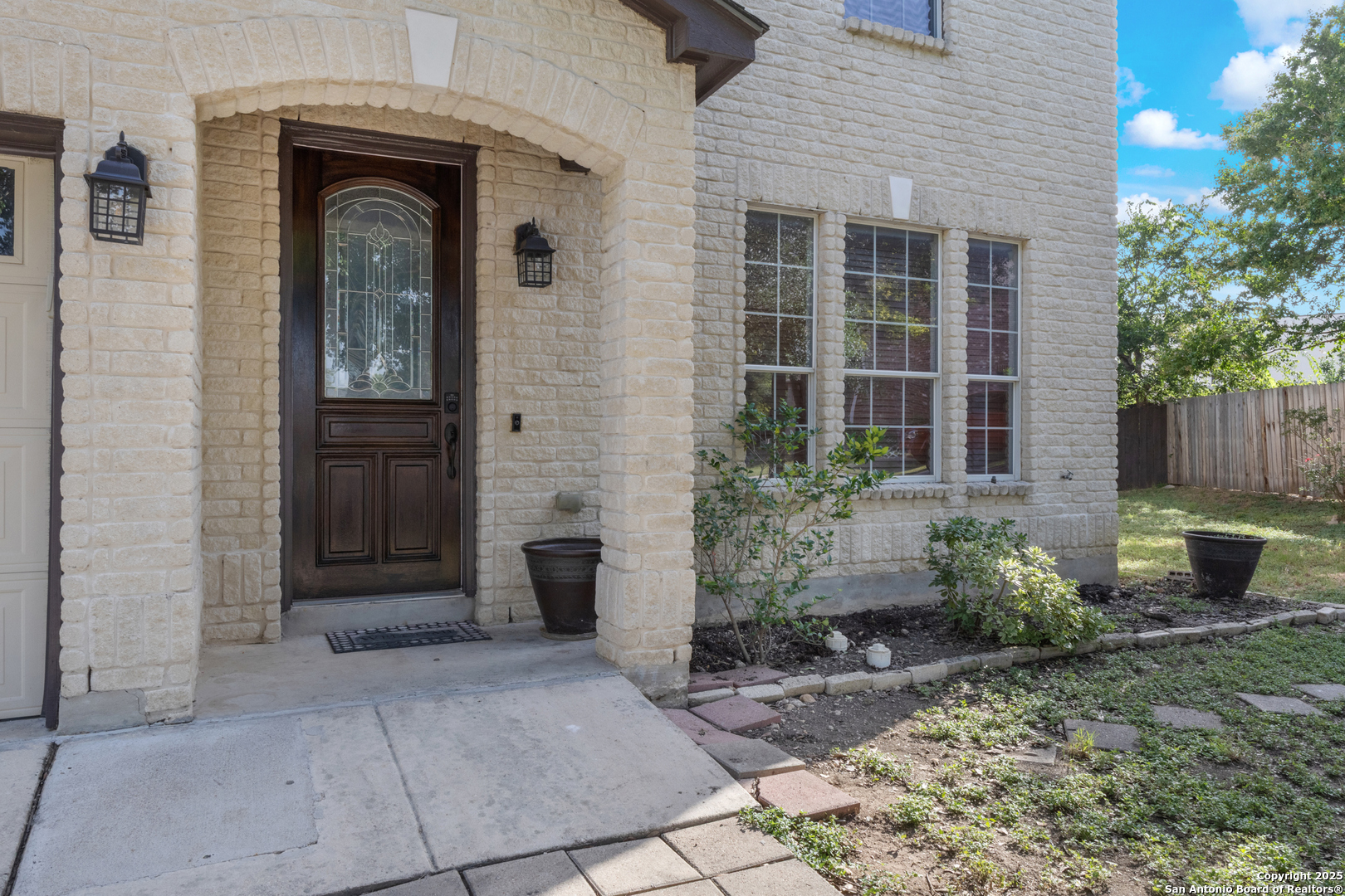 11101 Baywave Live Oak, TX 78233 - Photo 8 of 38 a front view of a house with garden