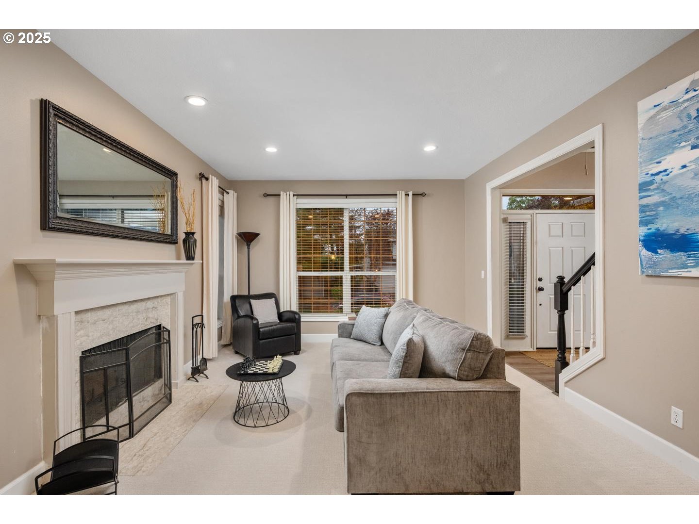 1626 Northwest Caitlin Terrace Portland, OR 97229 - Photo 13 of 48 a living room with furniture a fireplace and a flat screen tv