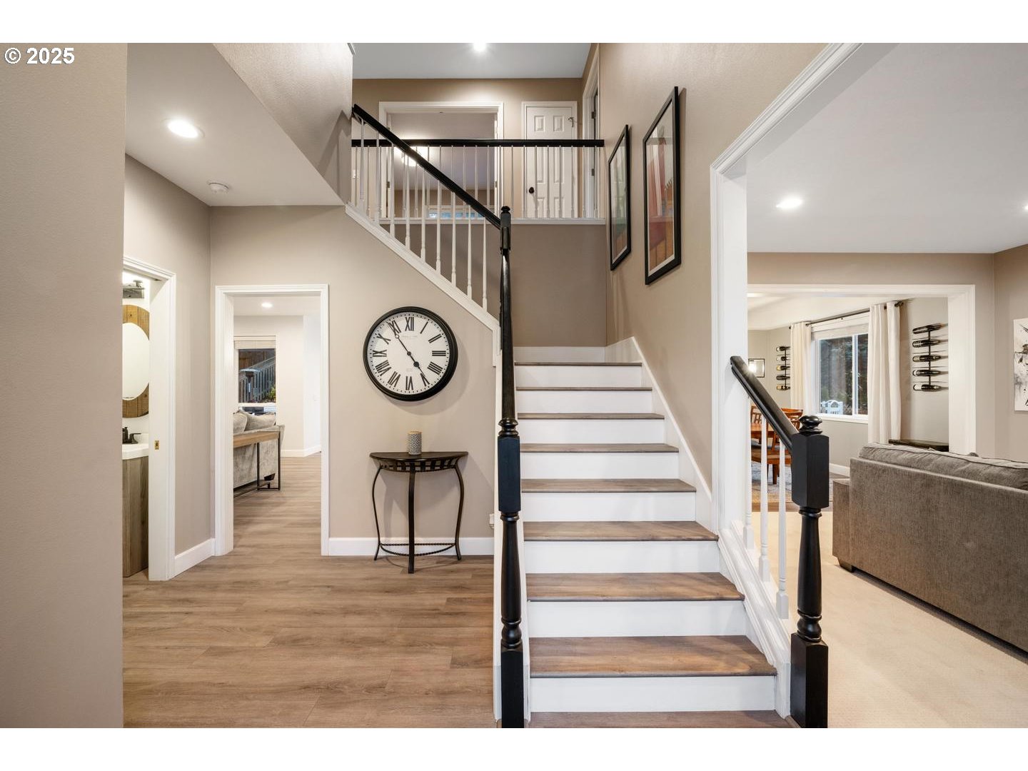 1626 Northwest Caitlin Terrace Portland, OR 97229 - Photo 15 of 48 a view of a hallway with wooden floor and a clock