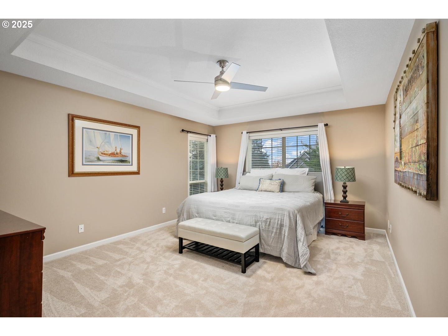 1626 Northwest Caitlin Terrace Portland, OR 97229 - Photo 18 of 48 a spacious bedroom with a bed and a chandelier